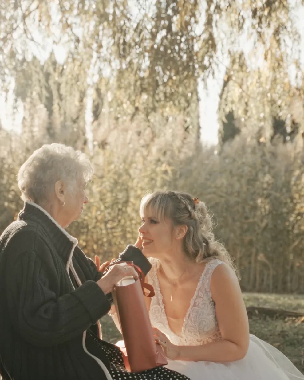 Anó sharing a quiet moment with a family member during the wedding day