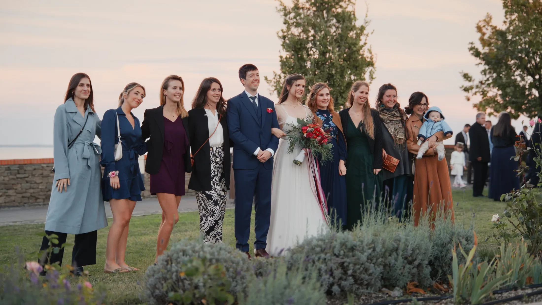 Dia and Beni with their guests during the evening celebration overlooking Lake Balaton