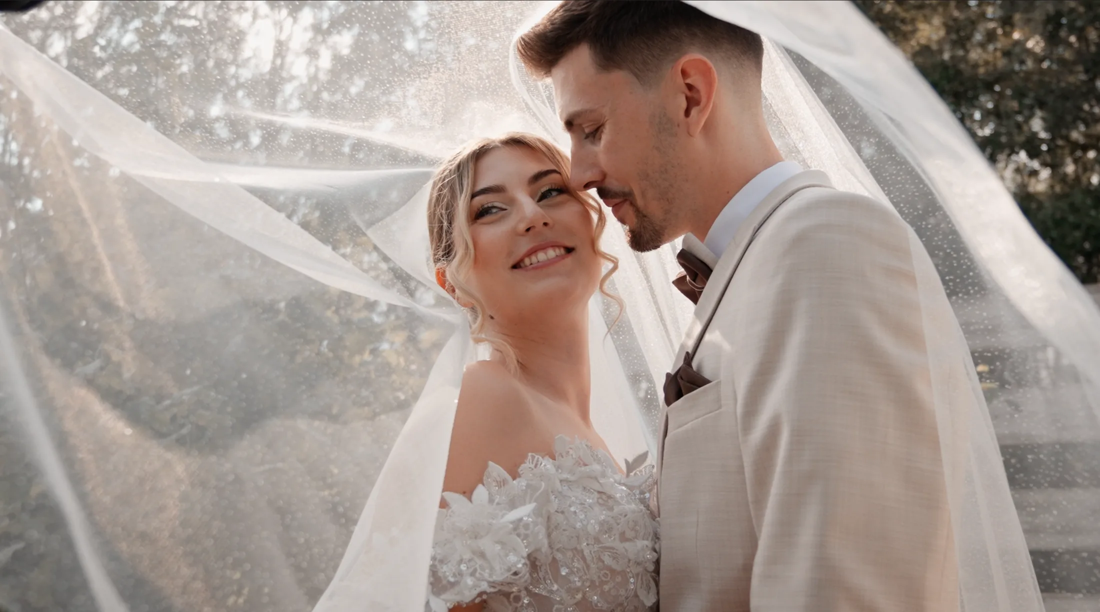 Fanni and Kristóf together beneath the wedding veil