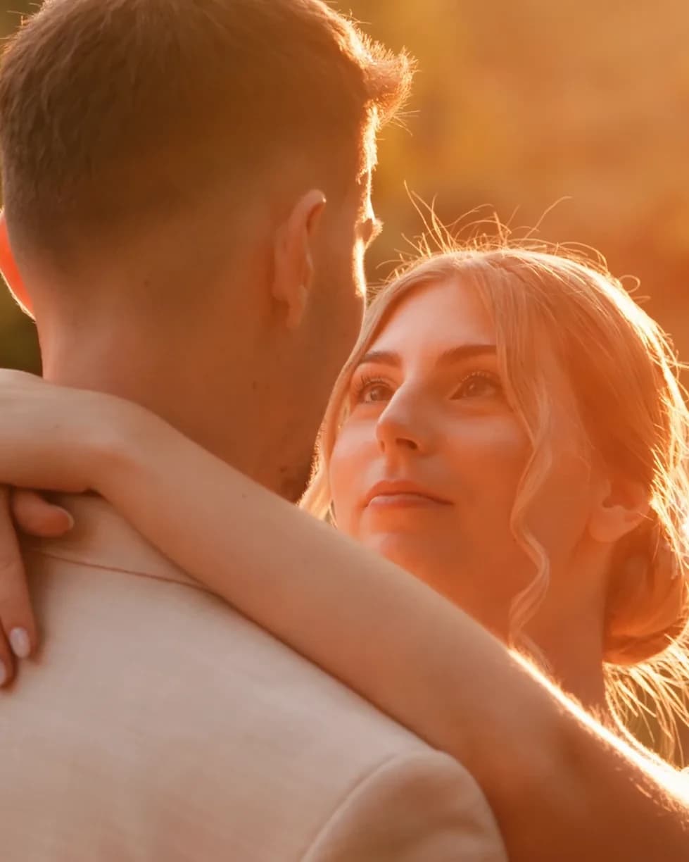 Golden-hour portrait of Fanni embracing Kristóf